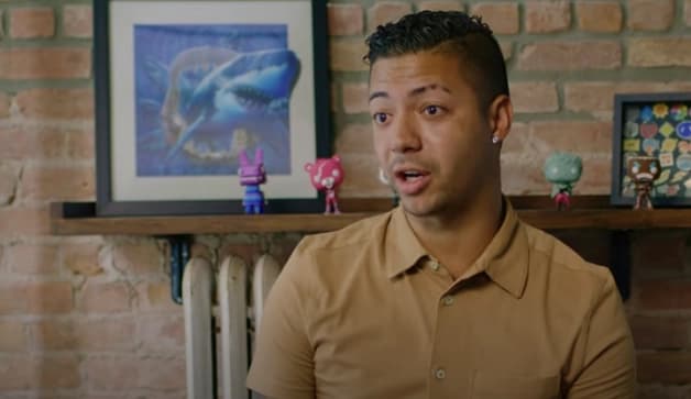 Man smiling because he found debt relief